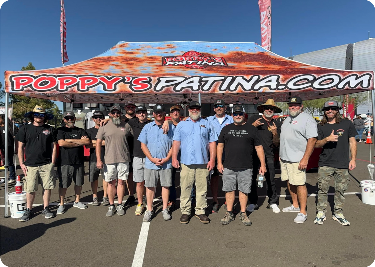 The Poppy's Patina team at the Poppy's booth at a car show