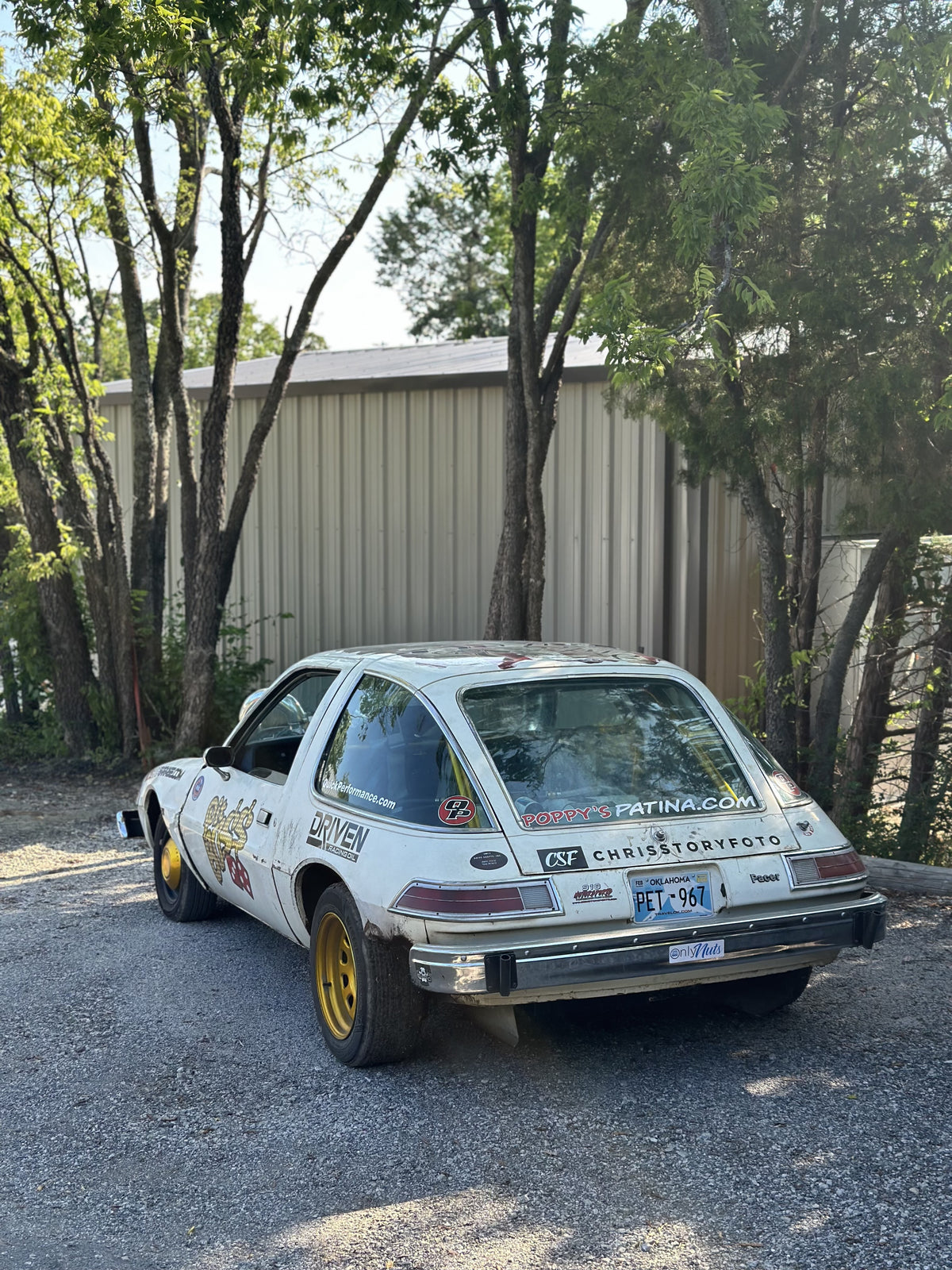 Rear three-quarter view of the Pit Boss AMC Pacer with gold wheels