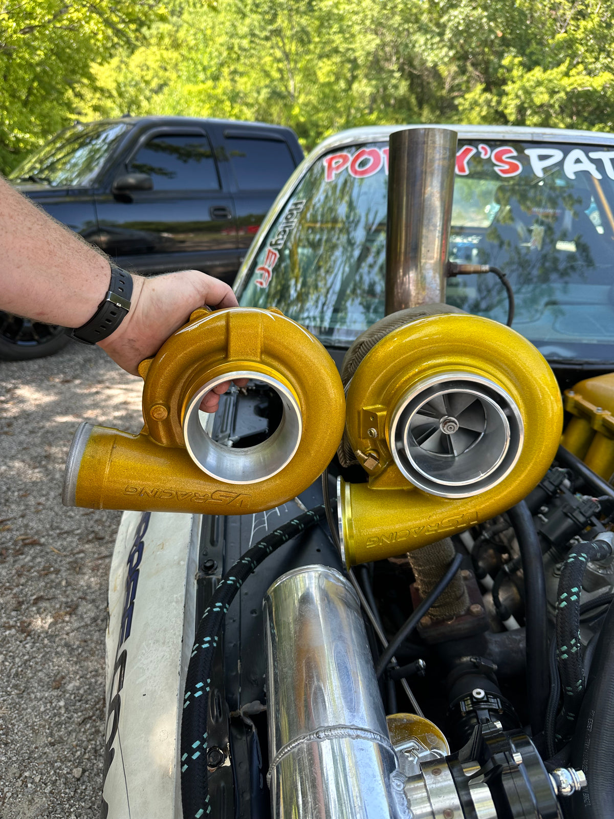 Close-up of gold turbo hardware and polished piping in the Pit Boss engine bay