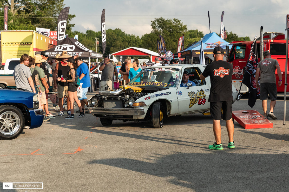 Pit Boss AMC Pacer in the pit area with spectators around it