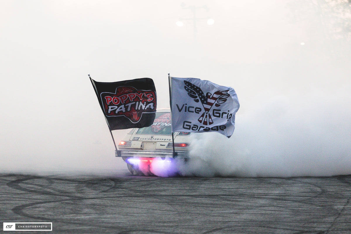 Poppy's Patina and Vice Grip Garage flags on Pit Boss in tire smoke