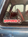 red sticker on car